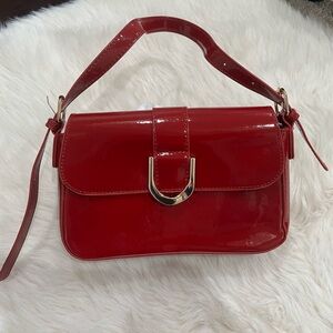 Red patent leather purse.